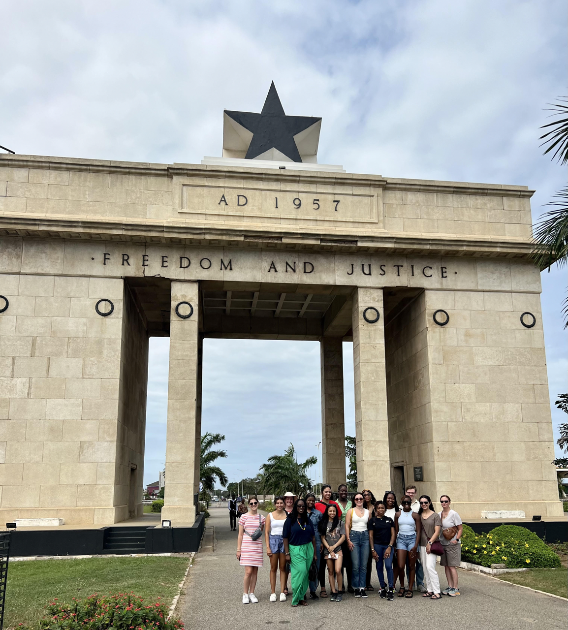 inaugural HESP-GPS cohort gather under the Independence Arch in Accra, Ghana