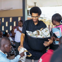 Donovan distributing food in Ghana