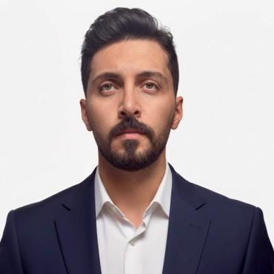 Headshot of Obada AlQasem in front of a white background. 