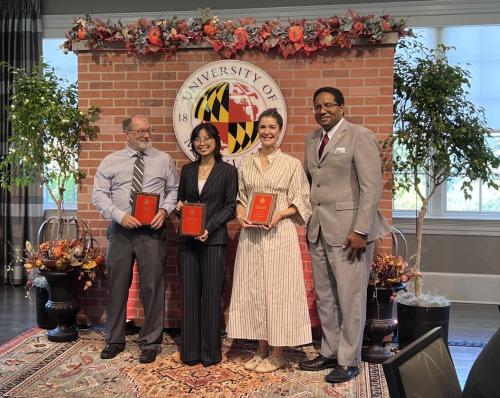 Yuri Kim with her mentors and President Pines with her award. 