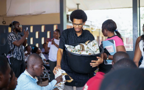 Donovan distributing food in Ghana